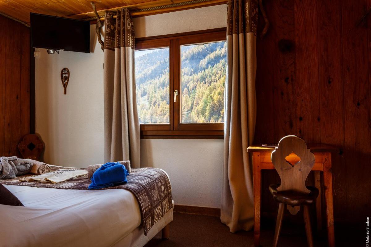 Un ou plusieurs lits dans un hébergement de l'établissement Hotel Spa L'Equipe