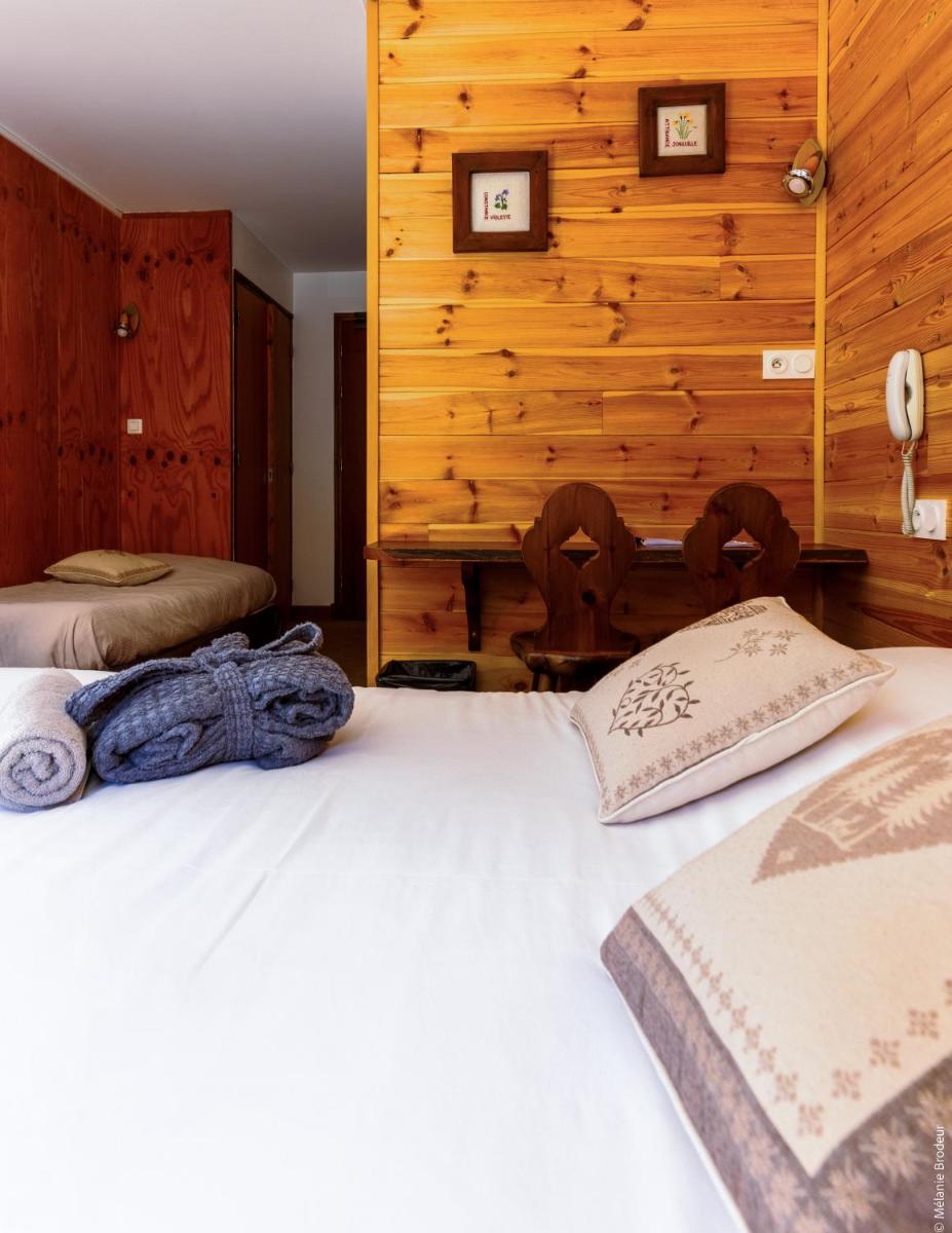 Un ou plusieurs lits dans un hébergement de l'établissement Hotel Spa L'Equipe