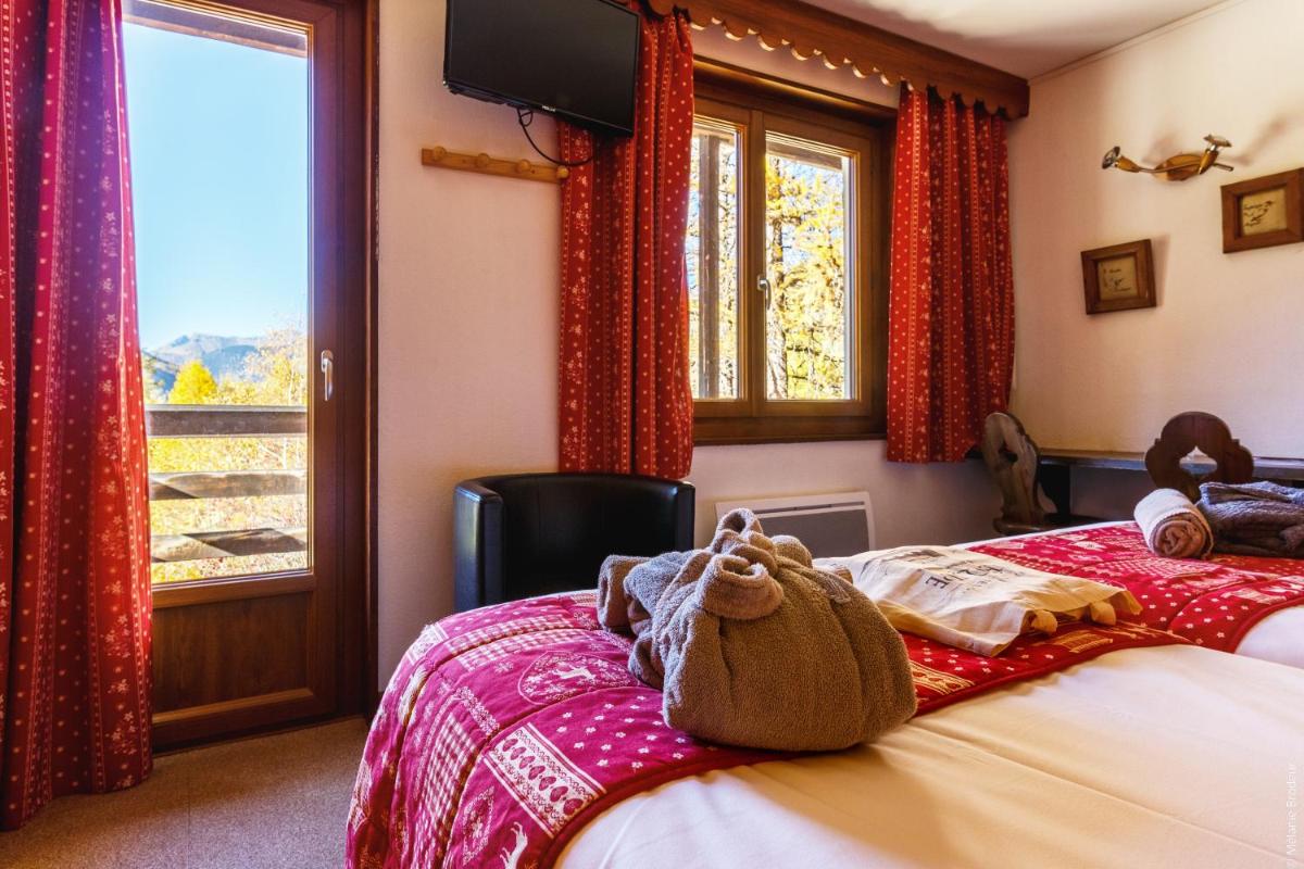 Un ou plusieurs lits dans un hébergement de l'établissement Hotel Spa L'Equipe