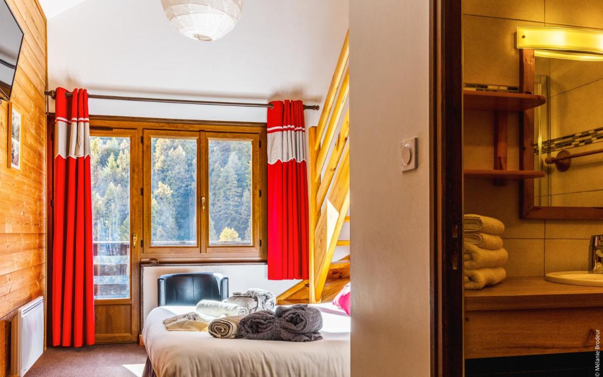 Un ou plusieurs lits dans un hébergement de l'établissement Hotel Spa L'Equipe