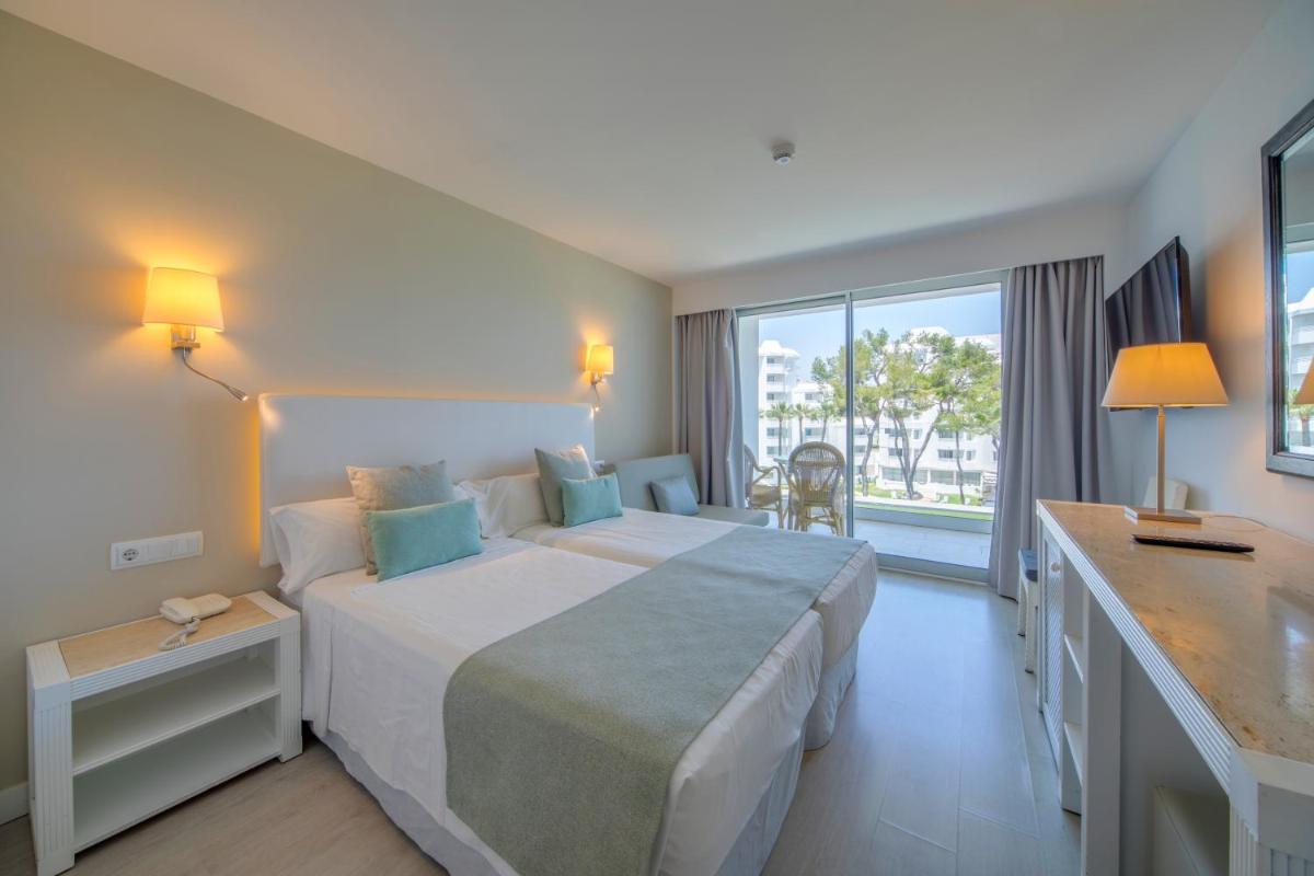 Cama o camas de una habitación en Playa Esperanza Resort Affiliated by Meliá