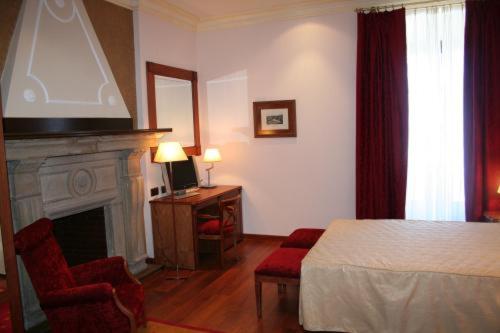 Cama o camas de una habitación en Hotel Palacio de la Magdalena