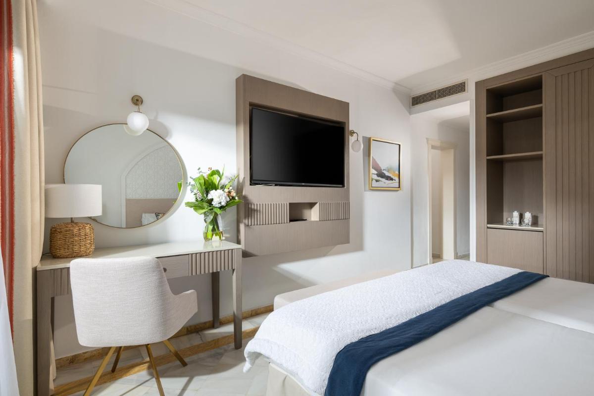 Cama o camas de una habitación en La Cala Resort