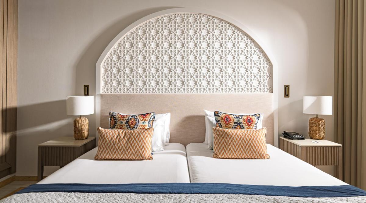 Cama o camas de una habitación en La Cala Resort