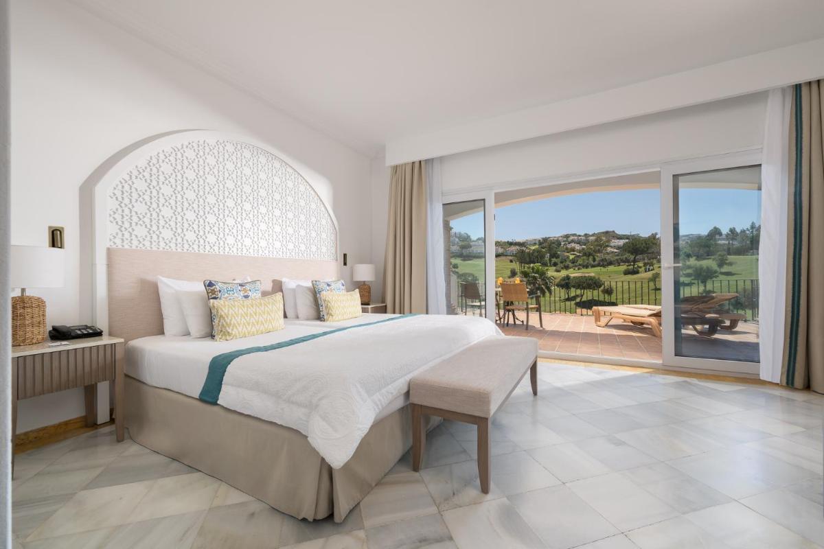 Cama o camas de una habitación en La Cala Resort