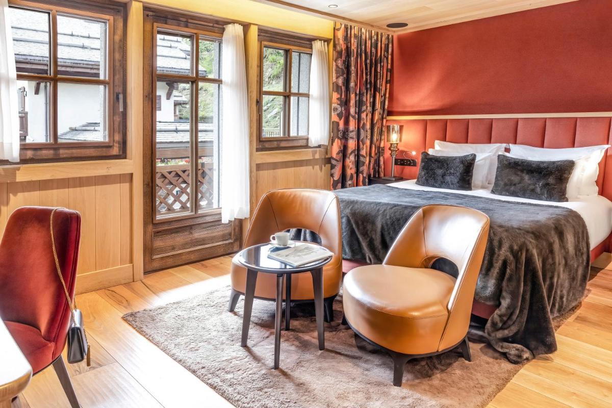 Un ou plusieurs lits dans un hébergement de l'établissement Armancette - The Leading Hotels of the World