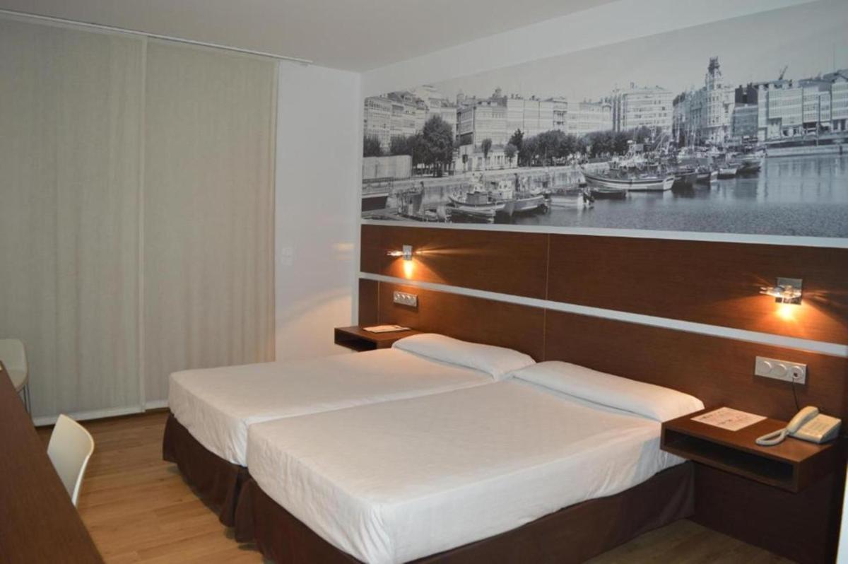 Cama o camas de una habitación en Hotel Spa Odeón
