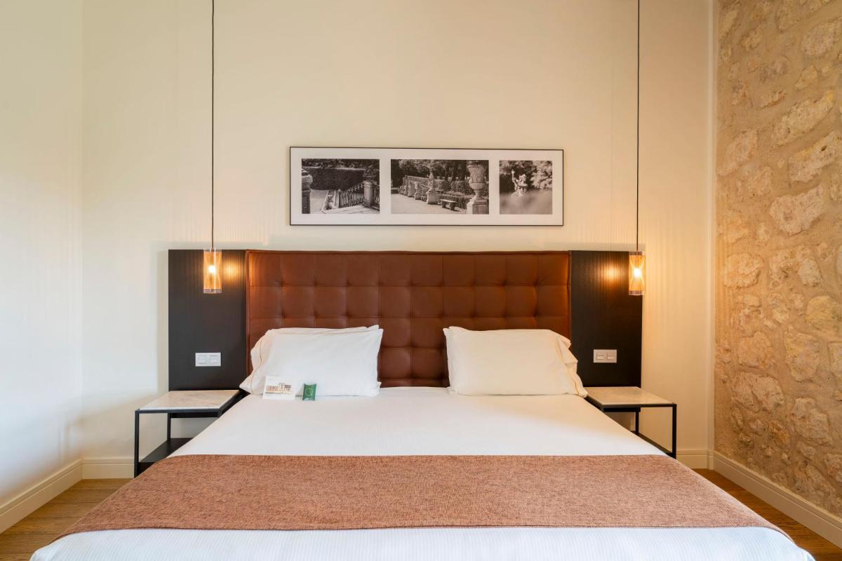 Cama o camas de una habitación en Áurea Convento Capuchinos by Eurostars Hotel Company