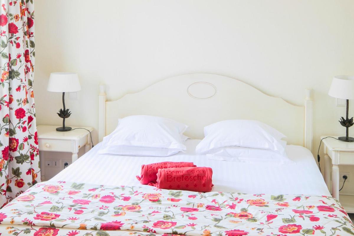 Un ou plusieurs lits dans un hébergement de l'établissement Hôtel & Spa de La Bretesche