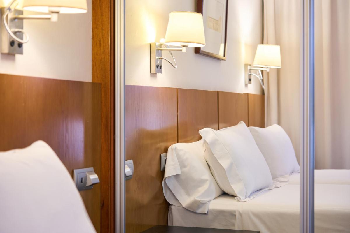 Cama o camas de una habitación en Senator Granada