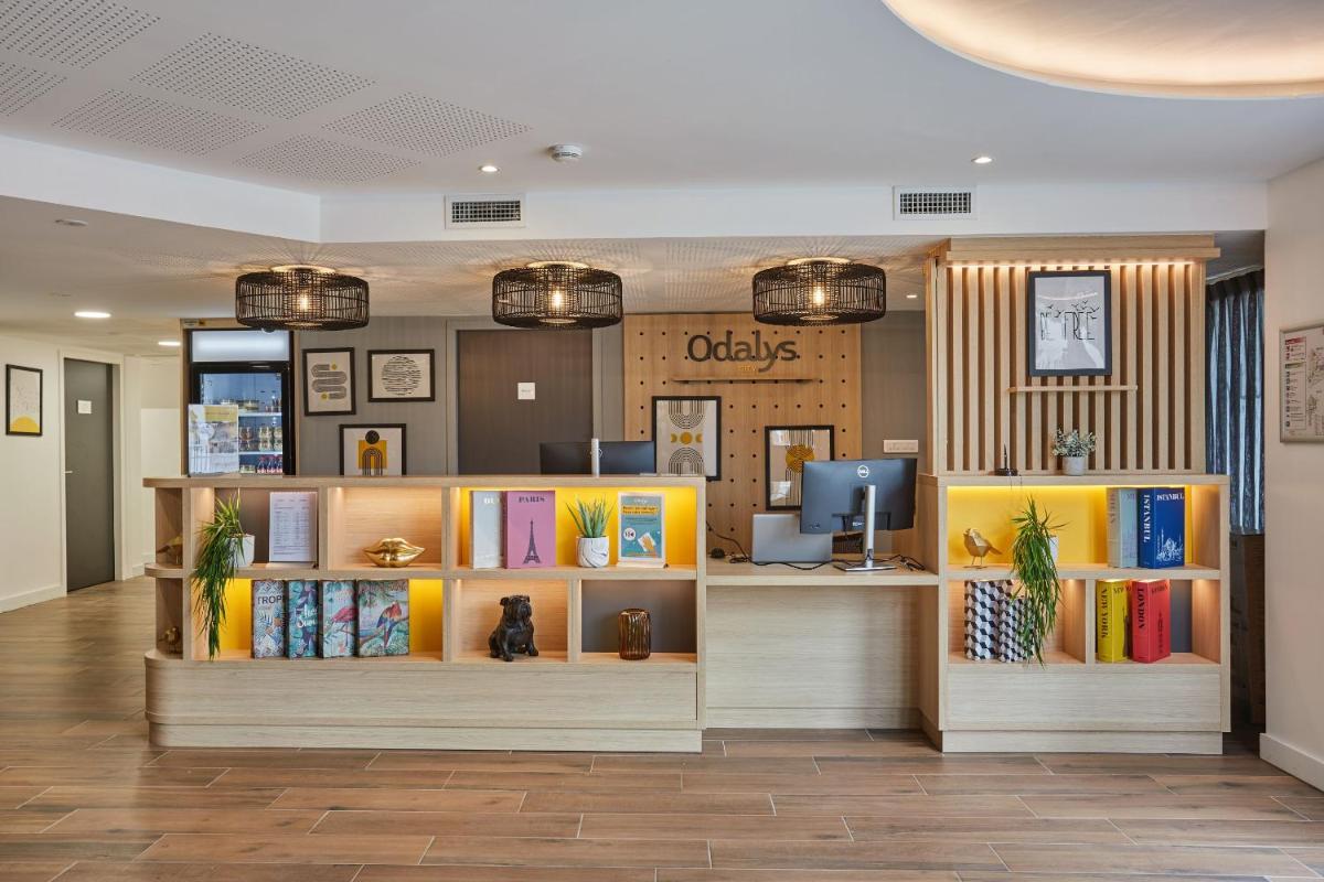 Coin salon dans l'établissement Appart'hôtel Odalys City - Nîmes Arènes - Palais des Congrès