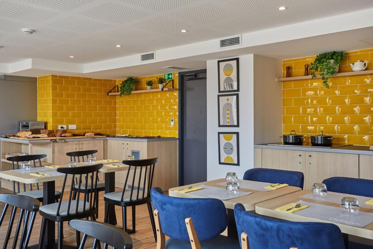 Restaurant ou autre lieu de restauration dans l'établissement Appart'hôtel Odalys City - Nîmes Arènes - Palais des Congrès
