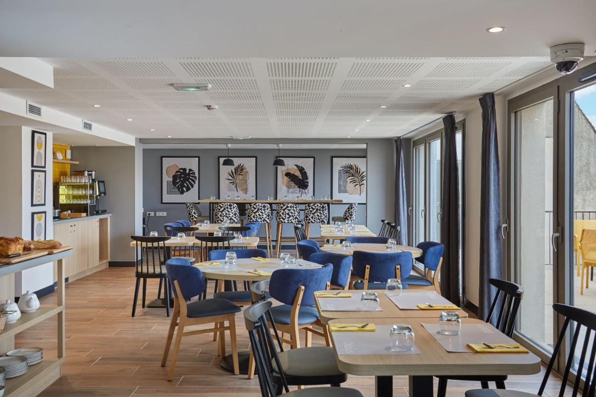 Coin salon dans l'établissement Appart'hôtel Odalys City - Nîmes Arènes - Palais des Congrès
