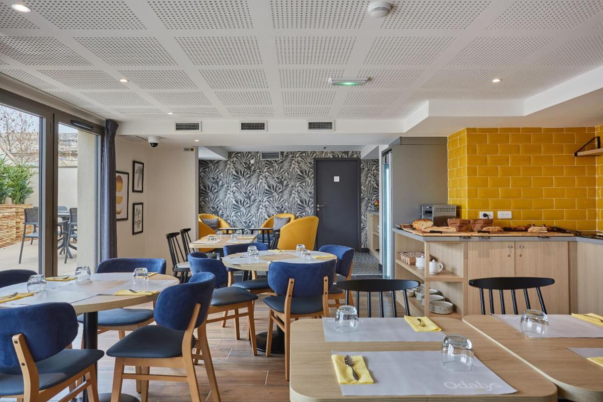 Coin salon dans l'établissement Appart'hôtel Odalys City - Nîmes Arènes - Palais des Congrès