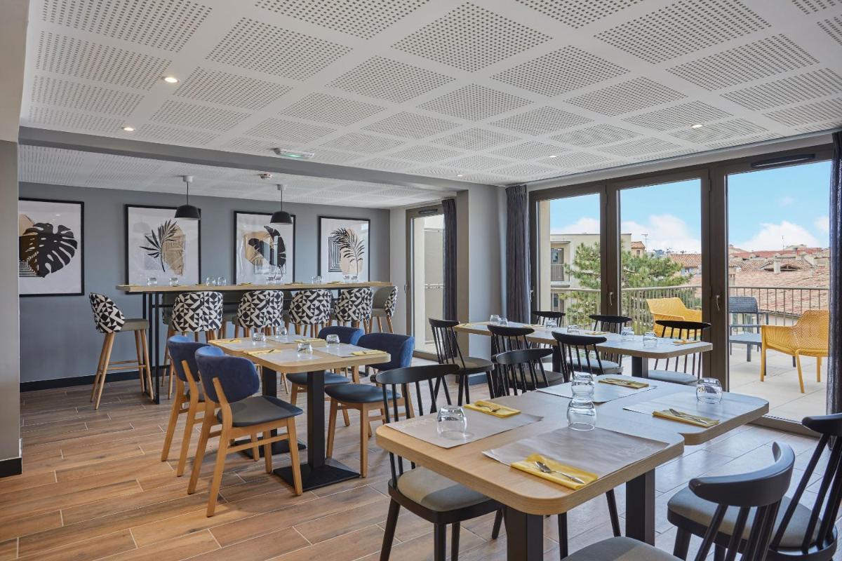 Restaurant ou autre lieu de restauration dans l'établissement Appart'hôtel Odalys City - Nîmes Arènes - Palais des Congrès