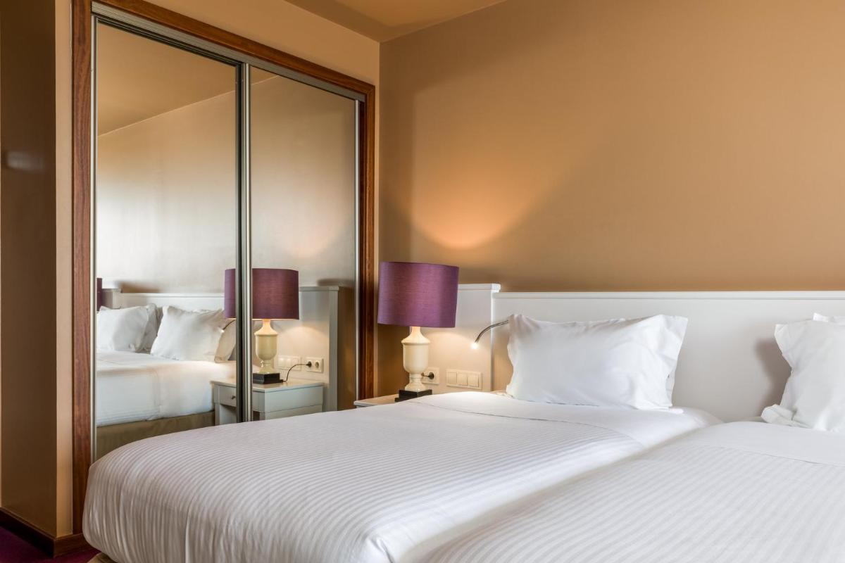 Uma cama ou camas num quarto em Holiday Inn Porto Gaia by IHG