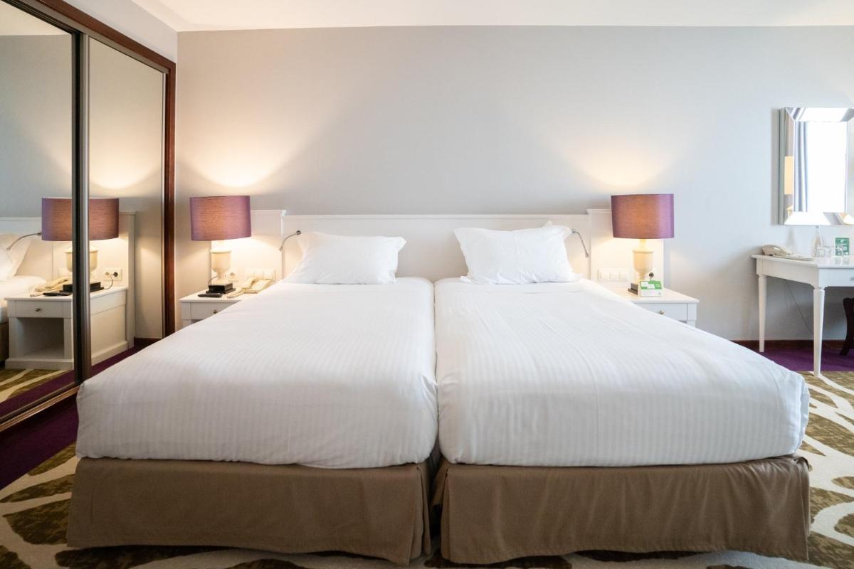 Uma cama ou camas num quarto em Holiday Inn Porto Gaia by IHG