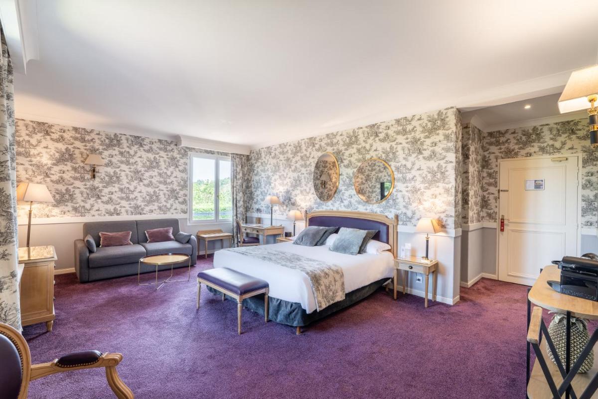 Un ou plusieurs lits dans un hébergement de l'établissement Le Manoir De La Poterie & Spa