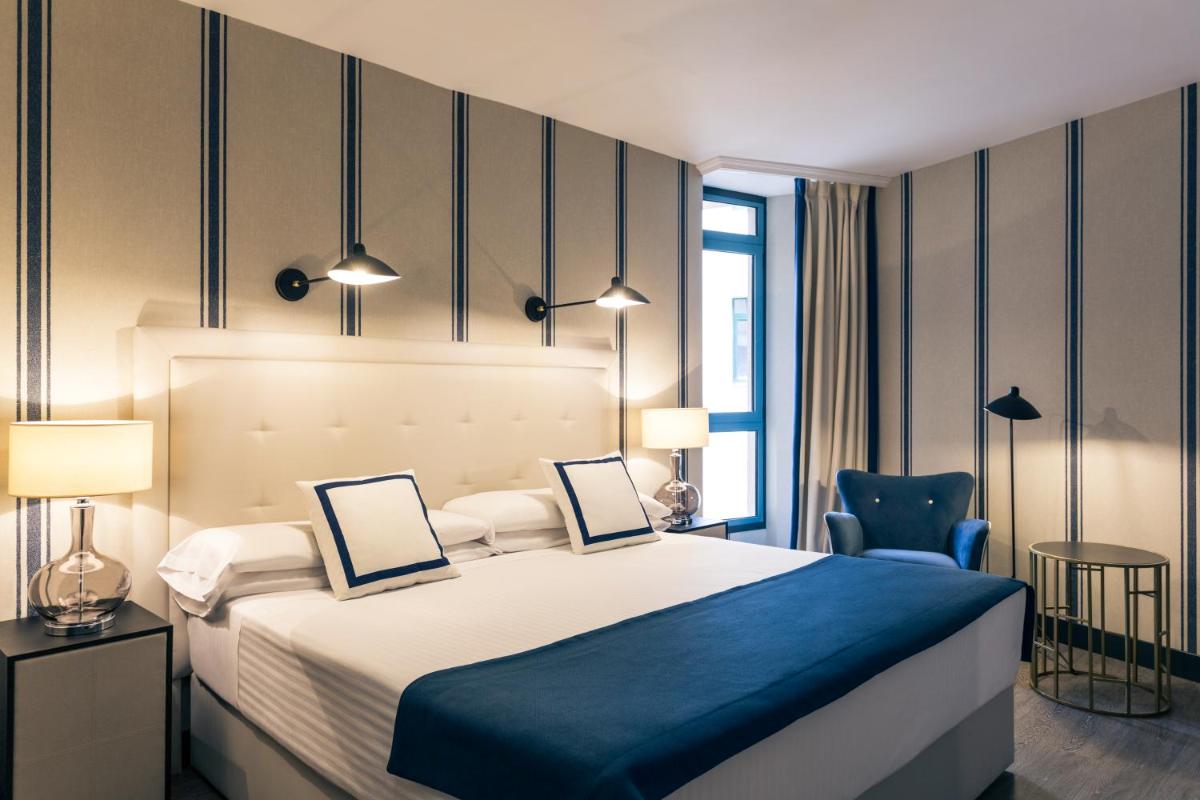 Cama o camas de una habitación en Hotel Mercure Jardines de Albia