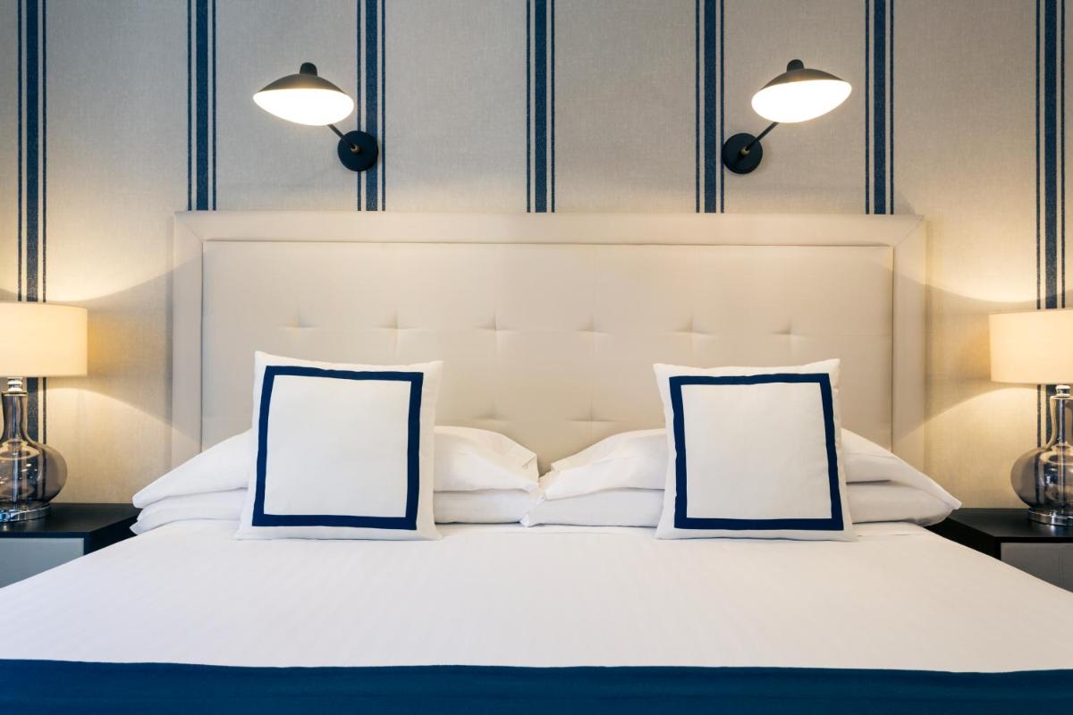 Cama o camas de una habitación en Hotel Mercure Jardines de Albia