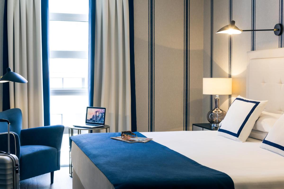 Cama o camas de una habitación en Hotel Mercure Jardines de Albia