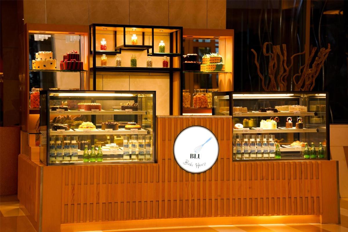 a display case in a store with some food at Radisson Blu Hotel Amritsar in Amritsar