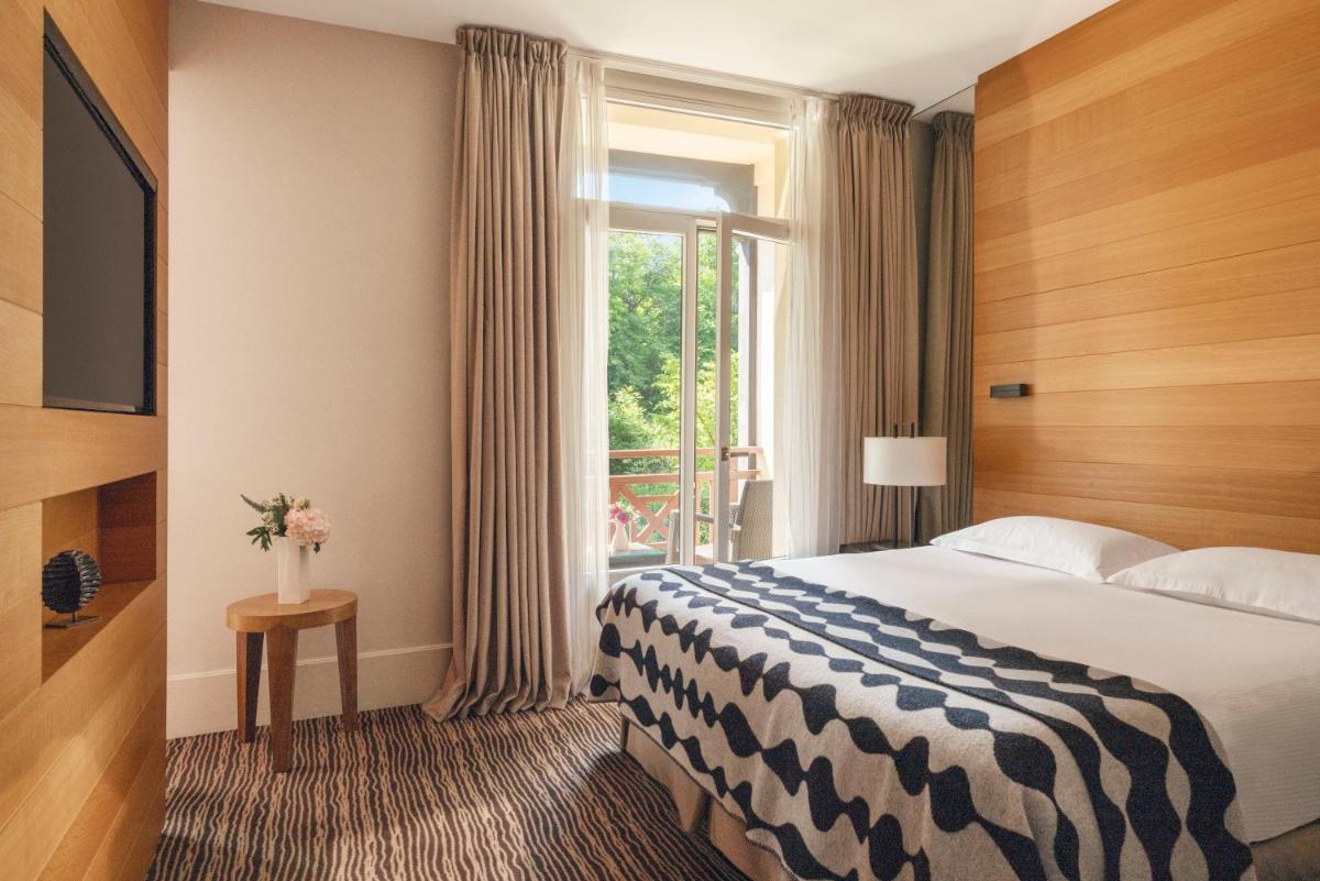 Un ou plusieurs lits dans un hébergement de l'établissement Hôtel Ermitage