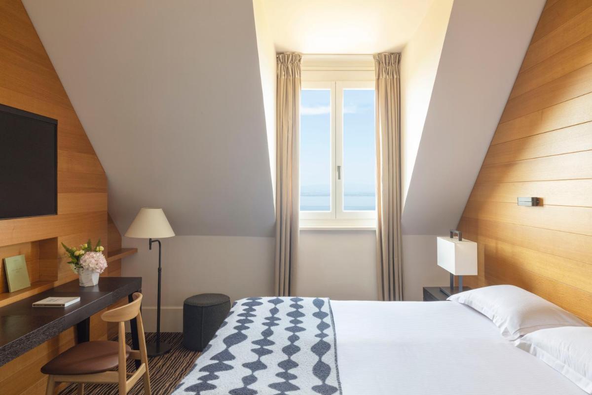 Un ou plusieurs lits dans un hébergement de l'établissement Hôtel Ermitage
