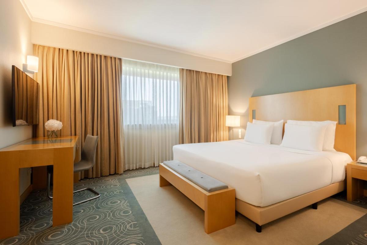Uma cama ou camas num quarto em SANA Malhoa Hotel