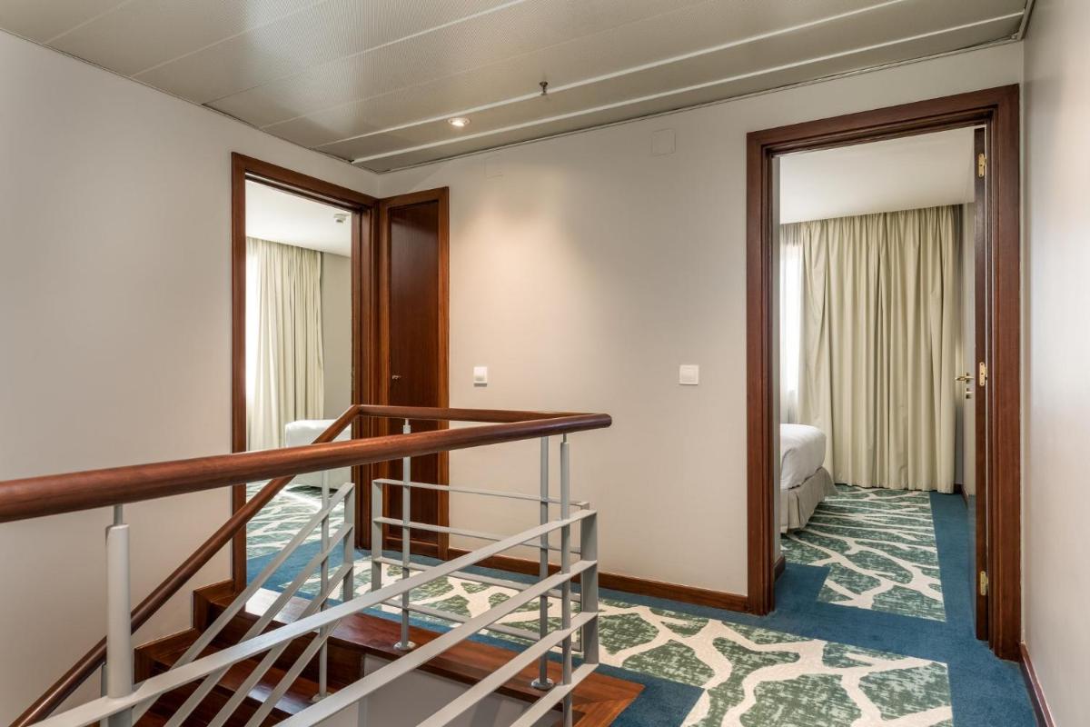 Uma cama ou camas num quarto em Holiday Inn Porto Gaia by IHG