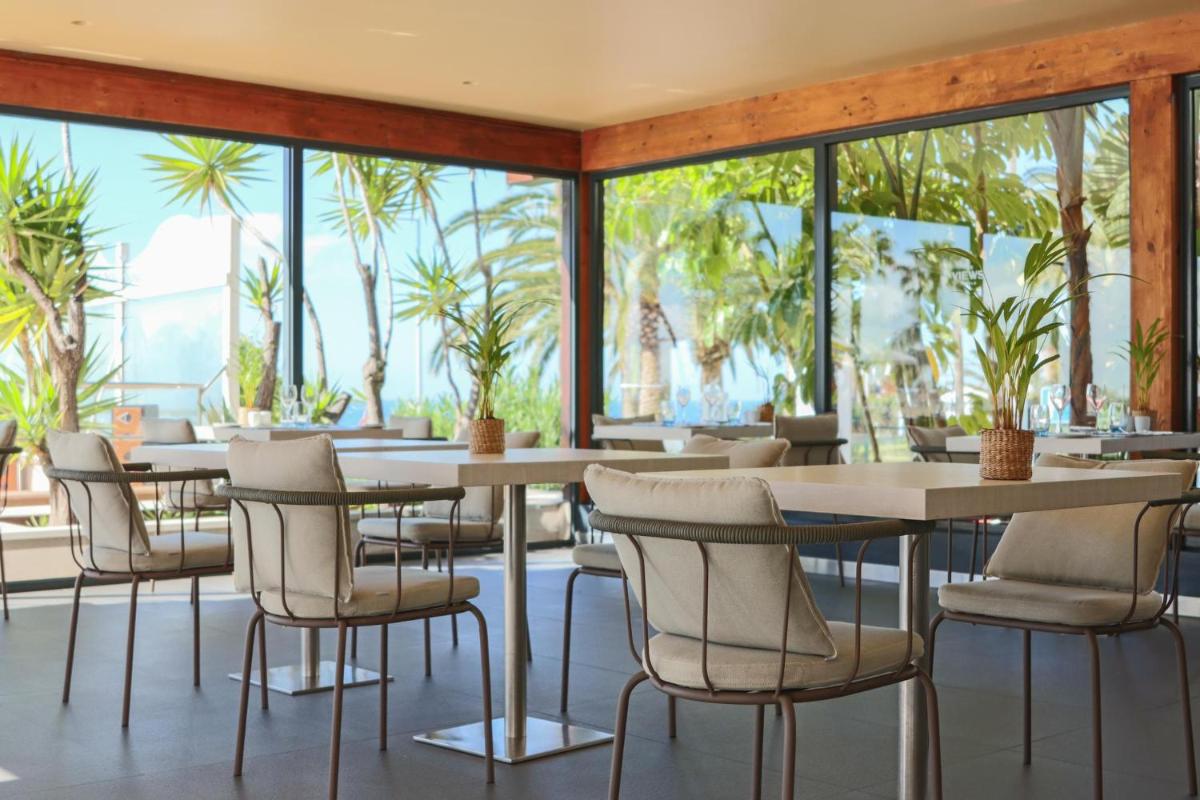Um restaurante ou outro lugar para comer em The Views Oasis