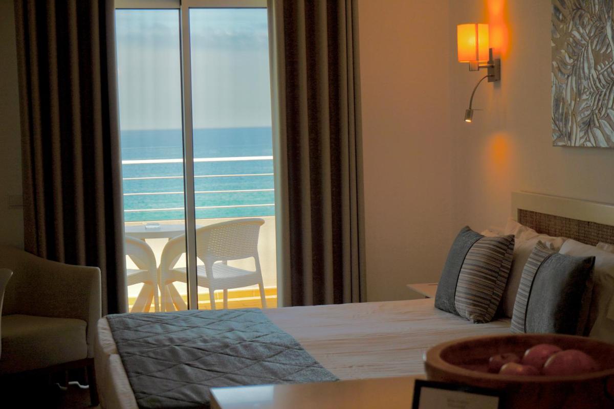Uma cama ou camas num quarto em Clube Porto Mos - Sunplace Hotels & Beach Resort