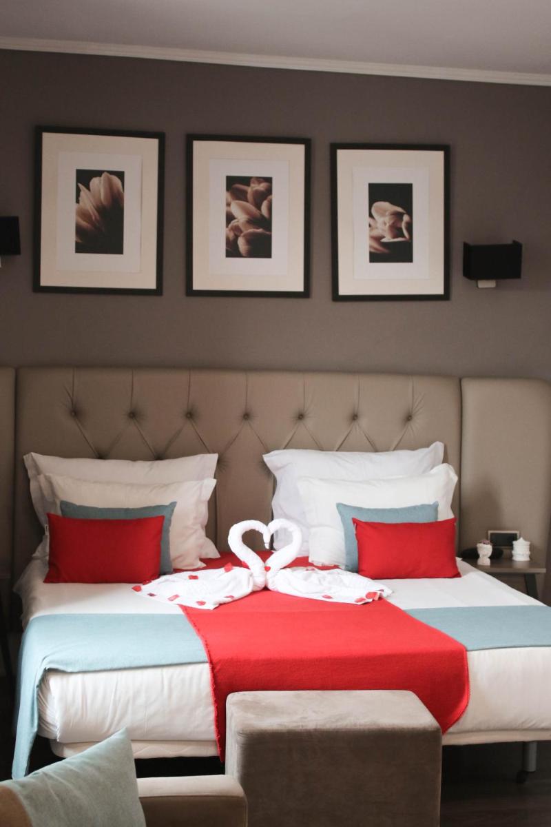 Uma cama ou camas num quarto em Hotel Bienestar Termas De Vizela