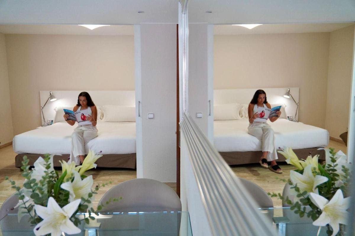 Cama o camas de una habitación en Aparthotel Los Girasoles