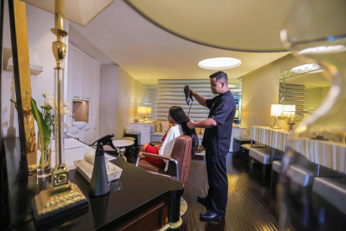 a man cutting the hair of a woman in a salon at The Leela Palace New Delhi in New Delhi +96 photos a man cutting the hair of a woman in a salon at The Leela Palace New Delhi in New Delhi +96 photos