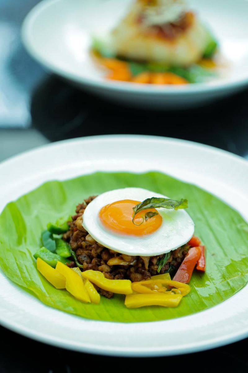 a plate of food with a fried egg on top at The Leela Palace New Delhi in New Delhi a plate of food with a fried egg on top at The Leela Palace New Delhi in New Delhi
