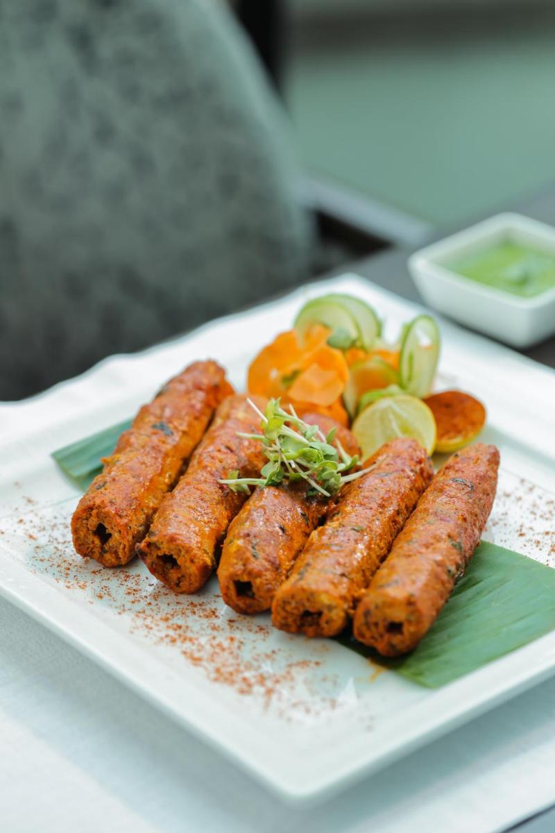 a plate of carrots and vegetables on a table at The Leela Palace New Delhi in New Delhi a plate of carrots and vegetables on a table at The Leela Palace New Delhi in New Delhi
