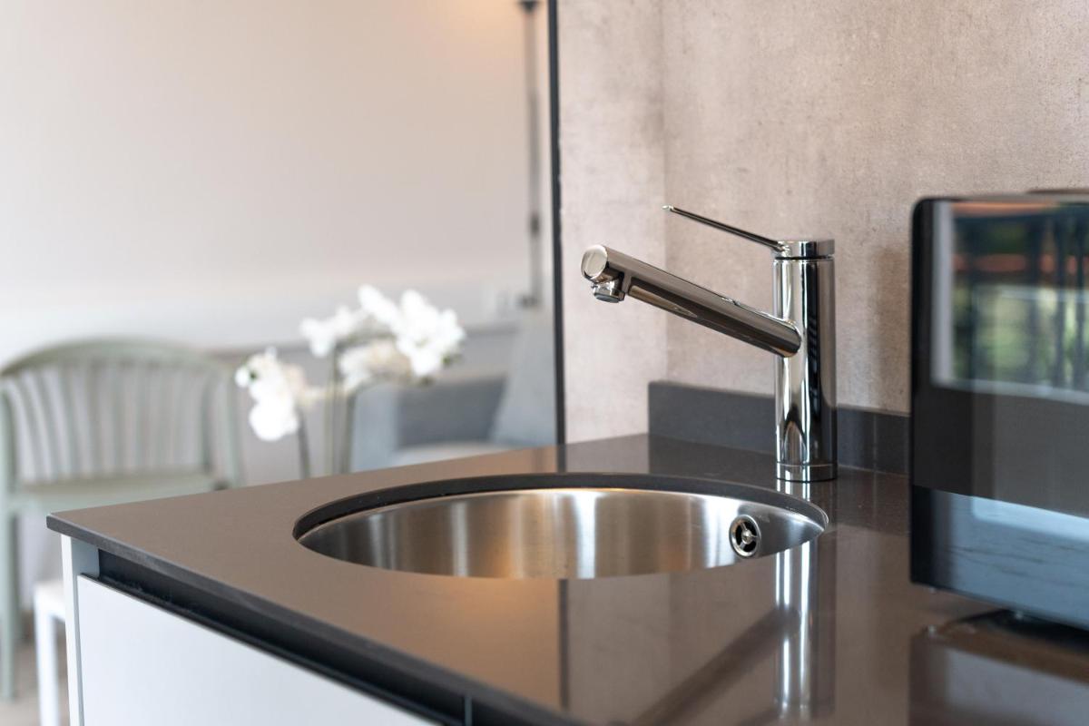 Apartamentos Turísticos El Puerto de Comillas - Housity
