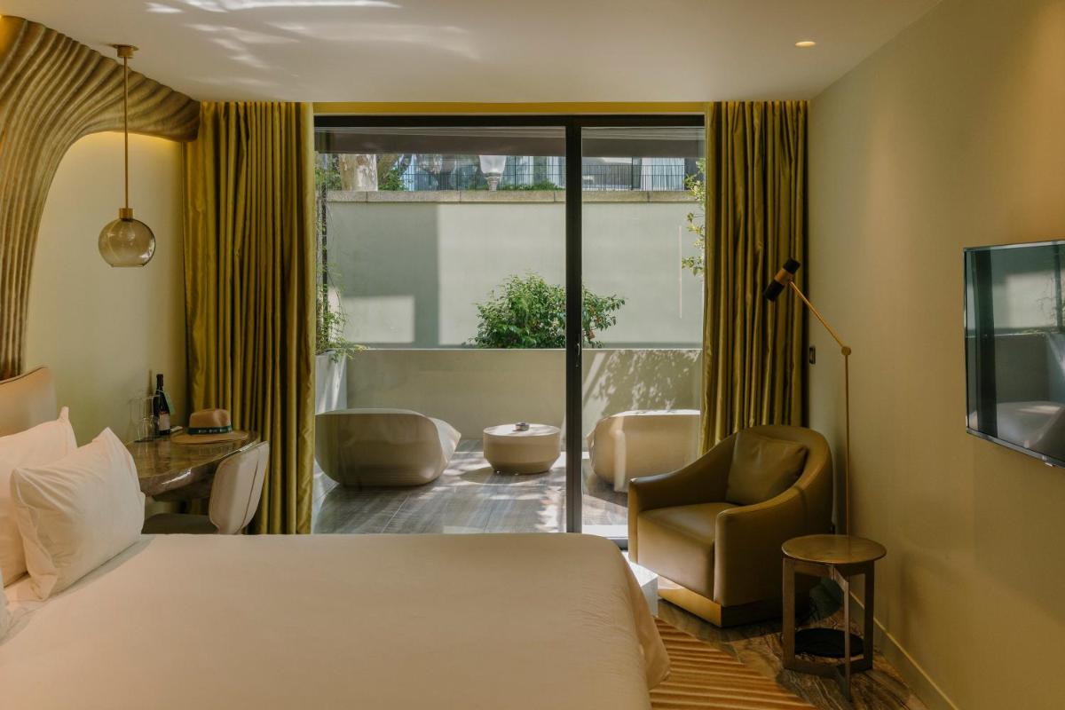 Uma cama ou camas num quarto em Vila Foz Hotel & SPA - member of Design Hotels