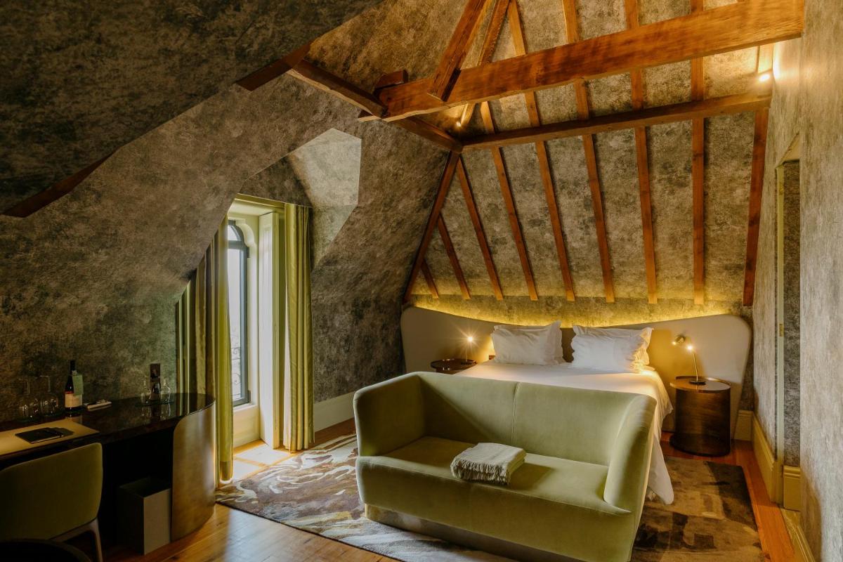 Uma cama ou camas num quarto em Vila Foz Hotel & SPA - member of Design Hotels