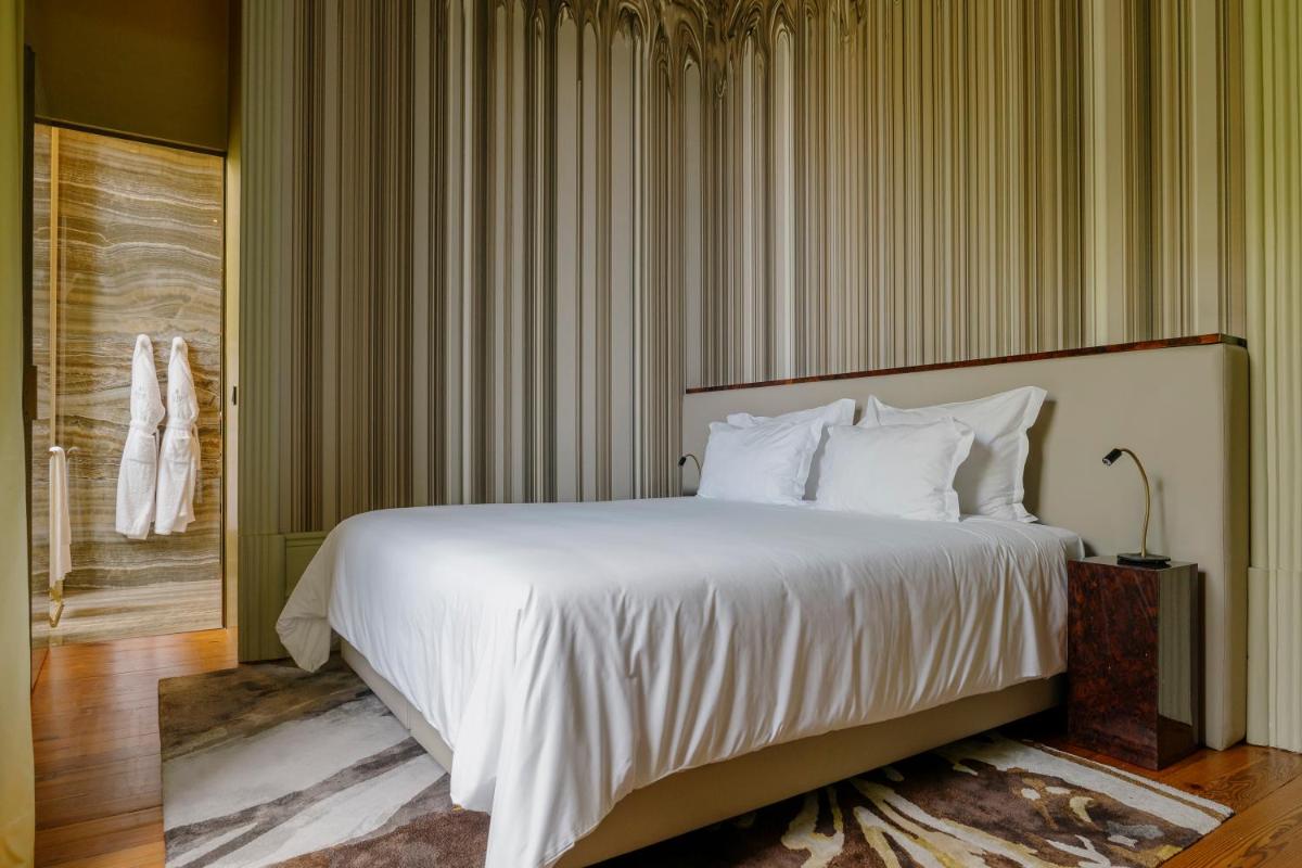 Uma cama ou camas num quarto em Vila Foz Hotel & SPA - member of Design Hotels