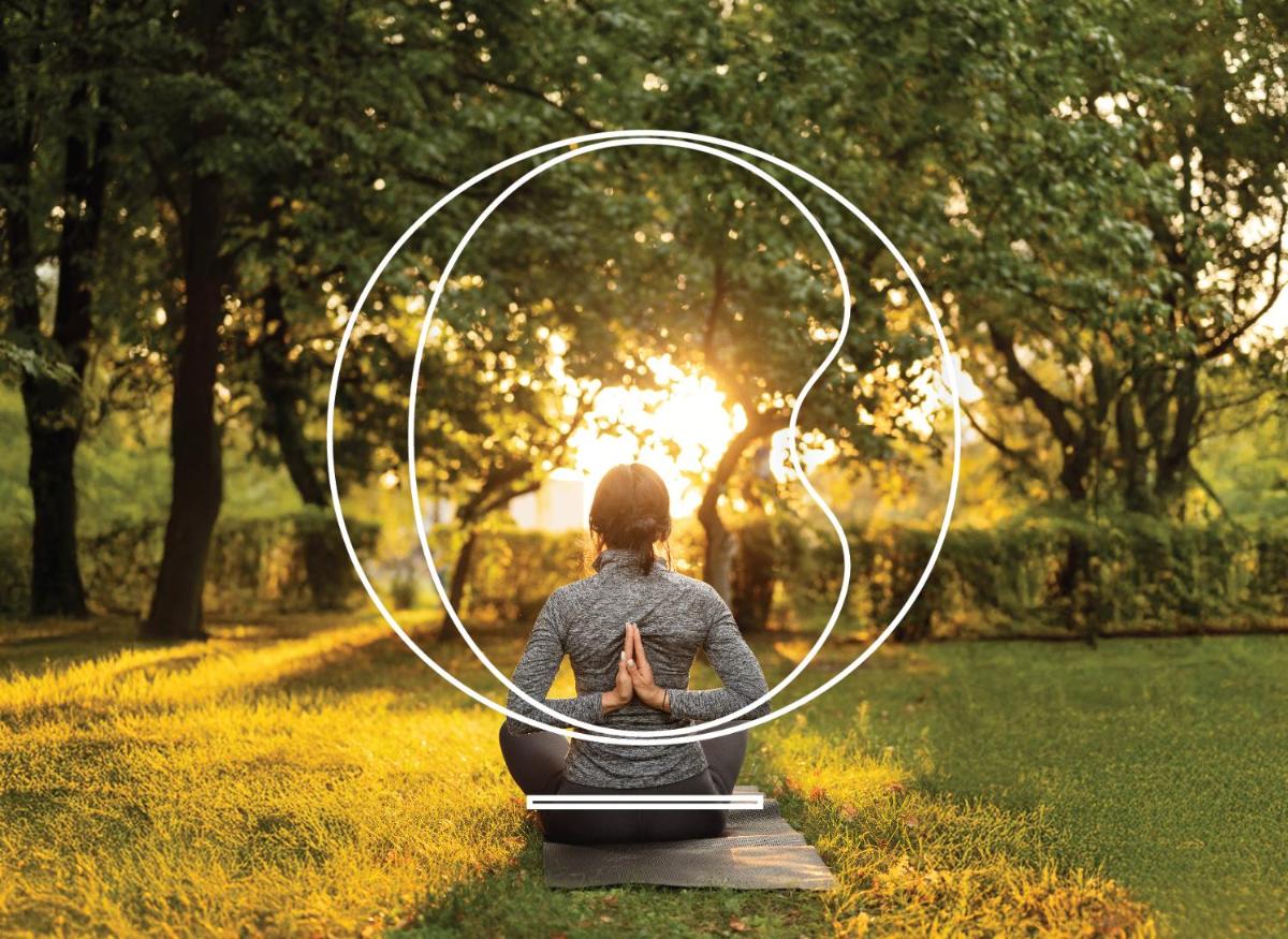a woman sitting in a circle in a field at Miros - Formerly Imperial Goa in Old Goa