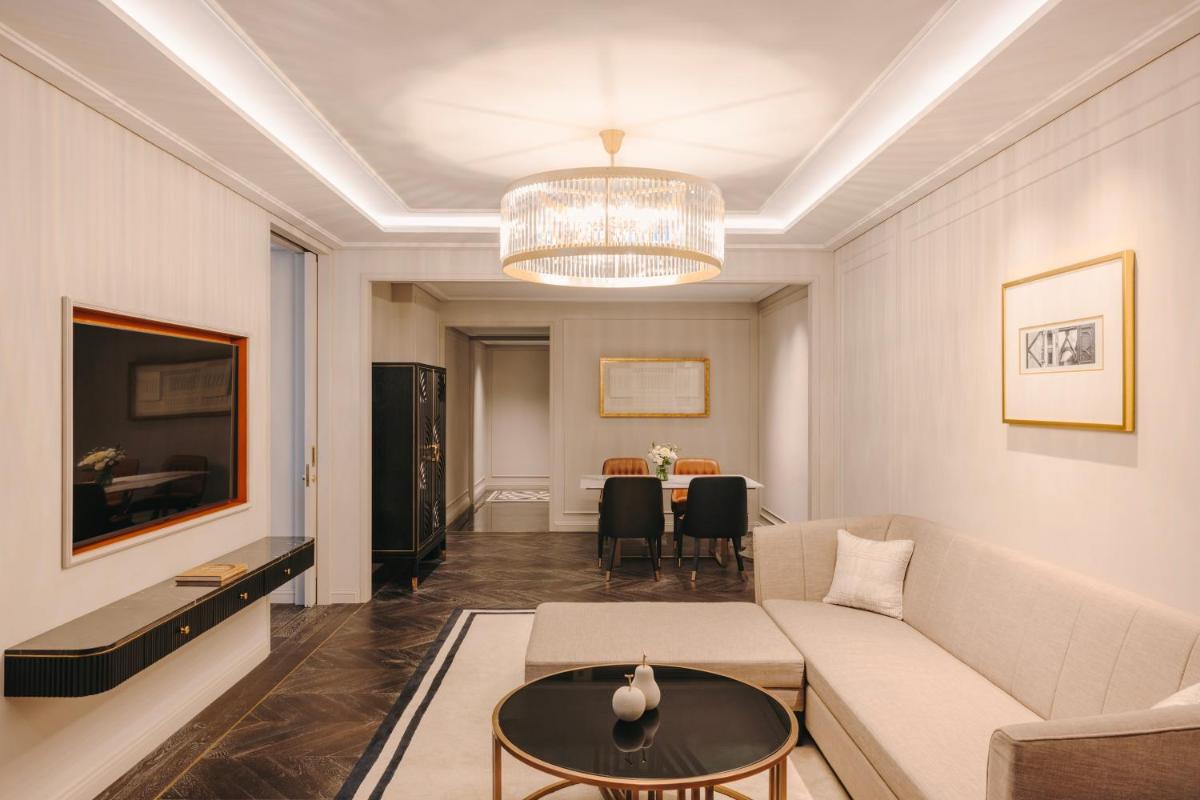 a living room with a couch and a table at Fairmont Mumbai in Mumbai