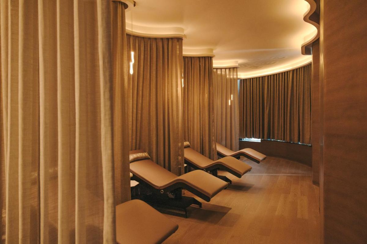 a row of chairs in a waiting room with curtains at Fairmont Mumbai in Mumbai