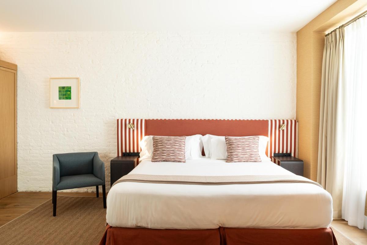 Cama o camas de una habitación en Cavalta Boutique Hotel - Small Luxury Hotels