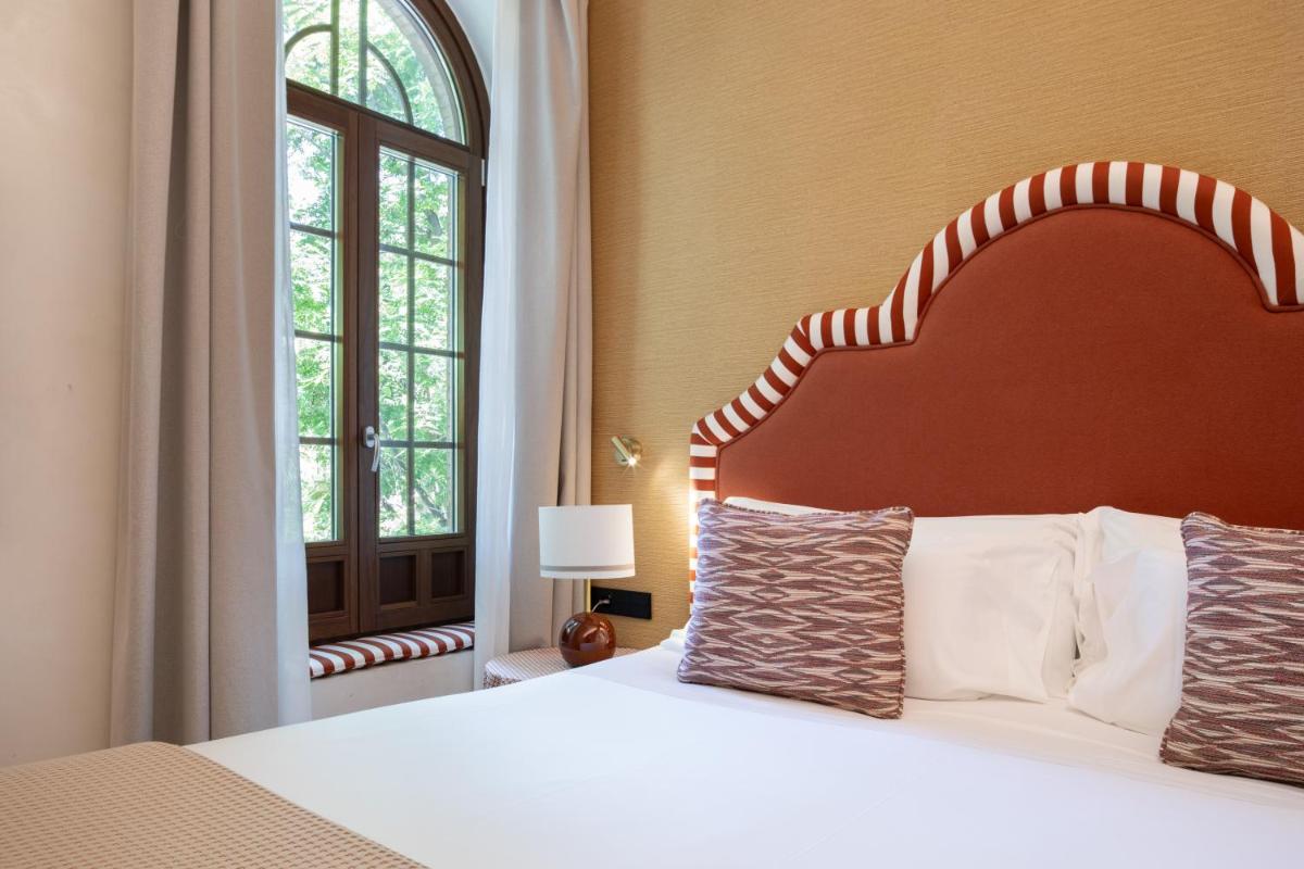 Cama o camas de una habitación en Cavalta Boutique Hotel - Small Luxury Hotels
