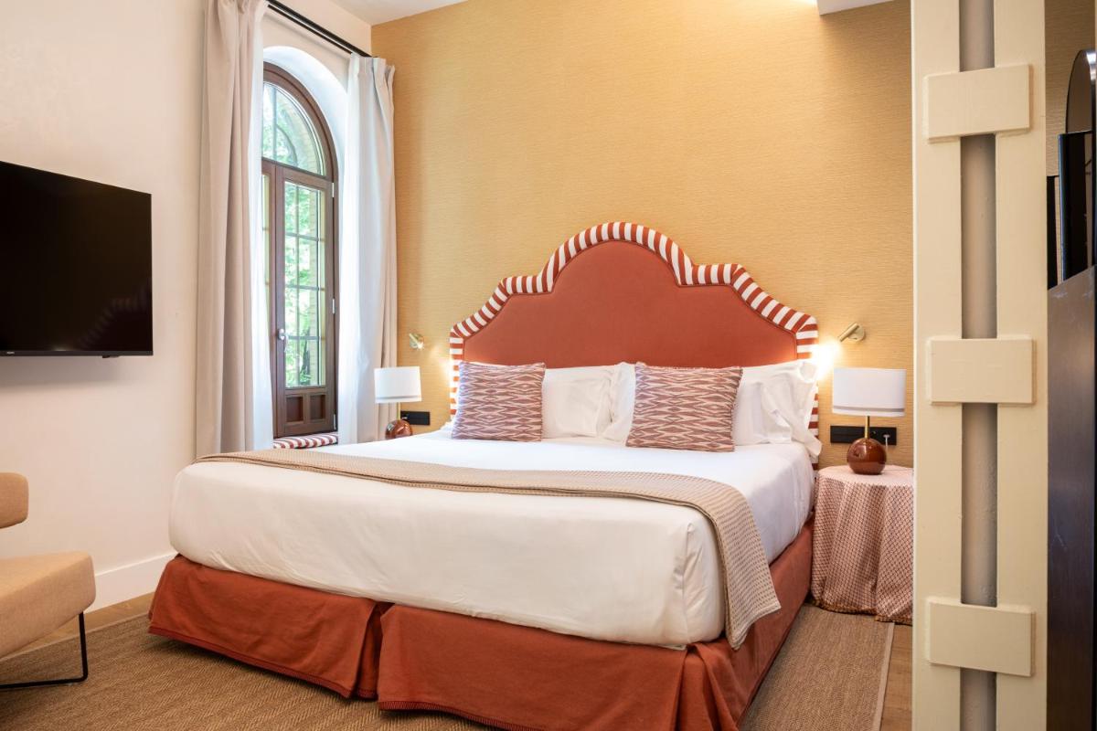 Cama o camas de una habitación en Cavalta Boutique Hotel - Small Luxury Hotels