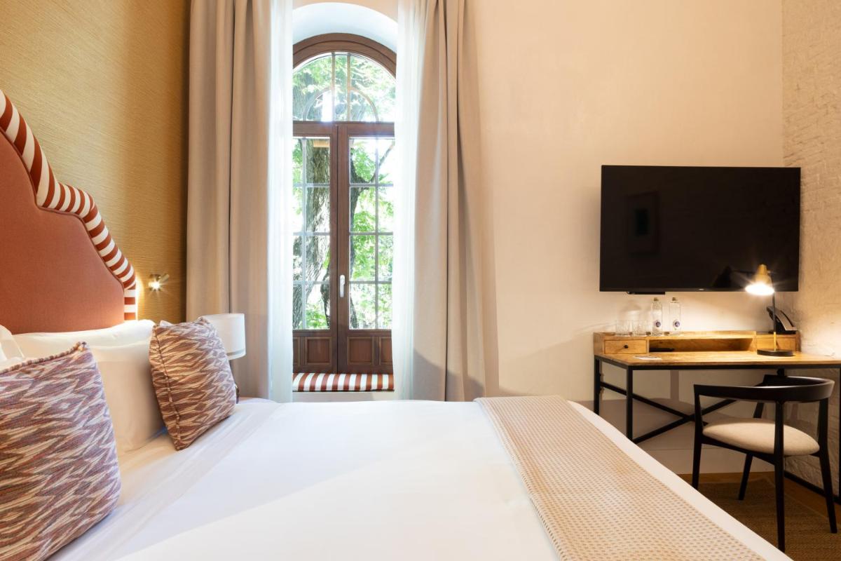 Cama o camas de una habitación en Cavalta Boutique Hotel - Small Luxury Hotels