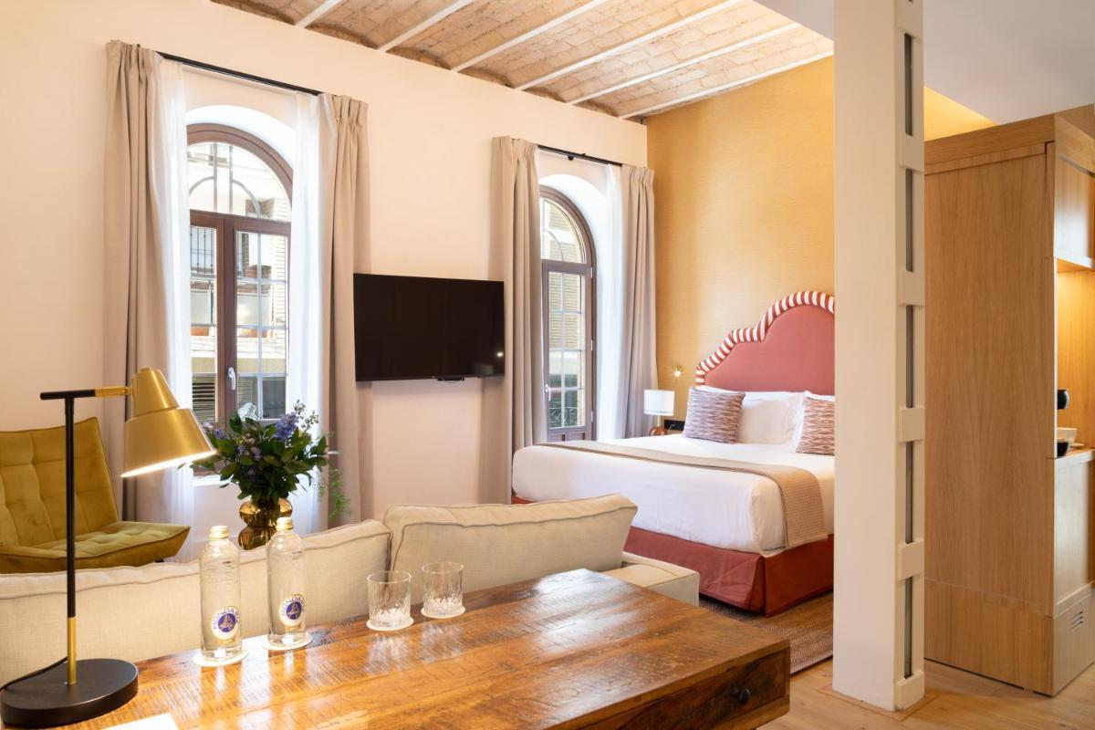 Una televisión o centro de entretenimiento en Cavalta Boutique Hotel - Small Luxury Hotels
