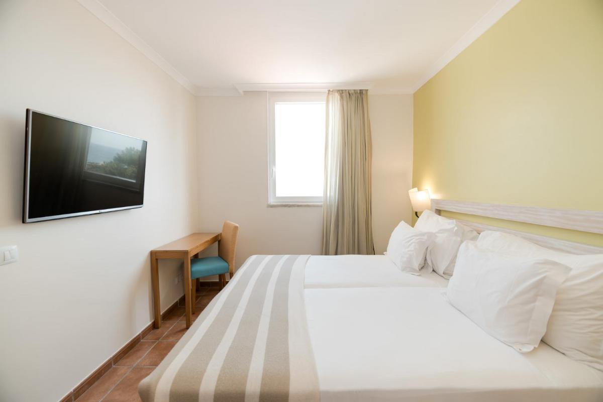 Uma cama ou camas num quarto em Pestana Viking Beach & SPA Resort